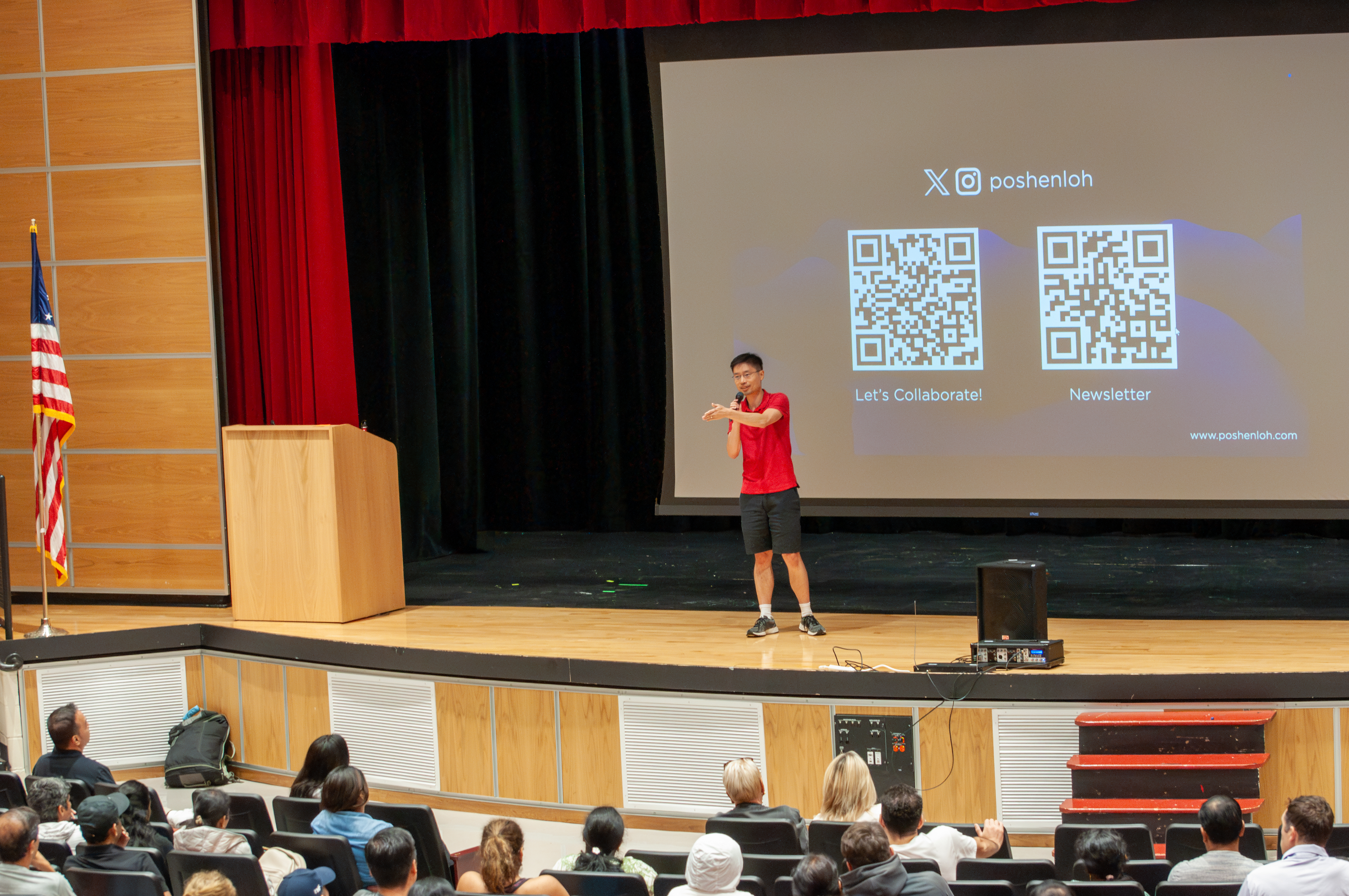 Po-Shen Loh presenting on stage