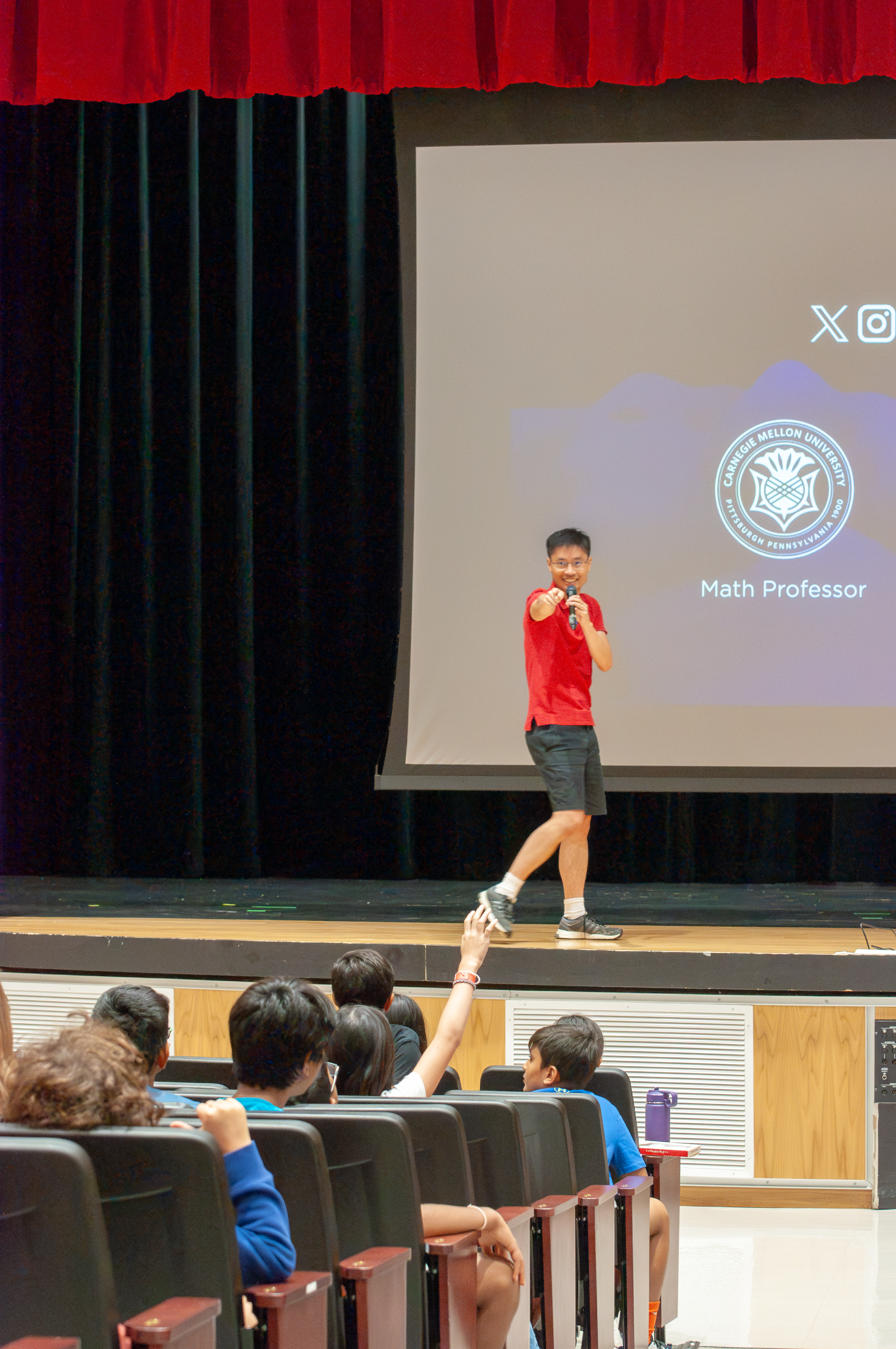 Po-Shen Loh gesturing during explanation